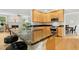 An eat-in kitchen features granite counters, light wood cabinets, and stainless appliances at 800 Highgrove Dr, Chapel Hill, NC 27516
