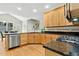 Kitchen featuring light wood cabinets, granite counters, and stainless steel appliances at 800 Highgrove Dr, Chapel Hill, NC 27516