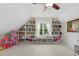 Bright playroom featuring custom built-ins, storage, window seat, and natural light at 800 Highgrove Dr, Chapel Hill, NC 27516
