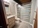 Bathroom with marble countertop vanity and glass door shower at 808 Indian Springs Rd, Chapel Hill, NC 27514
