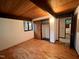Bedroom featuring hardwood floors, closet, and an adjacent room at 808 Indian Springs Rd, Chapel Hill, NC 27514