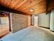 Large bedroom with carpeted floor and exposed brick wall at 808 Indian Springs Rd, Chapel Hill, NC 27514