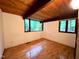 Bright bedroom with a wood-paneled ceiling and large windows with green outdoor views at 808 Indian Springs Rd, Chapel Hill, NC 27514