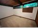 Bedroom with a wood-paneled ceiling, white walls, and a wall of windows overlooking nature at 808 Indian Springs Rd, Chapel Hill, NC 27514
