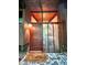 Close-up of the front door, featuring a modern design, wood accents, and glass panels for natural light at 808 Indian Springs Rd, Chapel Hill, NC 27514
