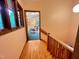Hallway with hardwood floors, light-colored walls, and a view into the living room at 808 Indian Springs Rd, Chapel Hill, NC 27514