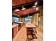 Bright kitchen features wood ceiling, stainless appliances, kitchen island and view to dining area at 808 Indian Springs Rd, Chapel Hill, NC 27514
