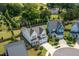 Aerial view of the home showcasing the backyard, mature trees, and neighborhood at 857 Mill Station Ln, Wendell, NC 27591