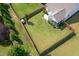 Aerial view of a private backyard featuring a well-kept lawn and fenced in area at 857 Mill Station Ln, Wendell, NC 27591