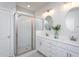 Bright bathroom features double sink vanity, walk-in shower and modern lighting at 857 Mill Station Ln, Wendell, NC 27591