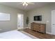 Comfortable bedroom with neutral tones, ceiling fan, and ensuite bathroom access at 857 Mill Station Ln, Wendell, NC 27591