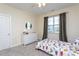 Bright bedroom features plush carpeting, ceiling fan and a window with backyard view at 857 Mill Station Ln, Wendell, NC 27591