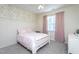 Cozy bedroom features a charming wallpaper, plush carpeting and a ceiling fan at 857 Mill Station Ln, Wendell, NC 27591