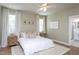 Comfortable bedroom with neutral tones, ceiling fan, and ensuite bathroom access at 857 Mill Station Ln, Wendell, NC 27591