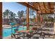 Community pool with a slide, splash pad, lounge chairs, and lake view at 857 Mill Station Ln, Wendell, NC 27591