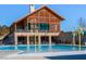 Community pool with a large recreational building, stone facade, and ample seating at 857 Mill Station Ln, Wendell, NC 27591