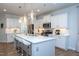 Modern kitchen with a large center island, stainless steel appliances, and ample counter space at 857 Mill Station Ln, Wendell, NC 27591