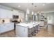 Bright and spacious kitchen with a large center island, stainless steel appliances, and open layout at 857 Mill Station Ln, Wendell, NC 27591