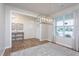 Formal entryway featuring hardwood floors, a modern light fixture, and ample natural light at 857 Mill Station Ln, Wendell, NC 27591