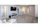 Spacious living room featuring plush carpet, television, and multiple access points at 857 Mill Station Ln, Wendell, NC 27591