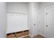 Bright mudroom features built-in bench, storage cubbies, and wood-look flooring at 857 Mill Station Ln, Wendell, NC 27591