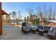 Inviting patio area with comfortable seating, perfect for relaxing and enjoying the scenic views of the lake at 857 Mill Station Ln, Wendell, NC 27591