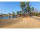 Community pond with pier, walking trail, and open green space at 857 Mill Station Ln, Wendell, NC 27591