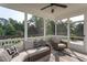 Inviting screened porch with comfortable wicker furniture, providing a serene outdoor space at 857 Mill Station Ln, Wendell, NC 27591