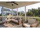 Relaxing screened porch with comfortable wicker seating and a view of the backyard at 857 Mill Station Ln, Wendell, NC 27591