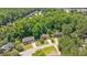 An aerial view shows well-maintained homes surrounded by dense trees in a quiet, residential neighborhood at 904 Oldwyck Dr, Fuquay Varina, NC 27526