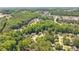 Panoramic aerial view of homes nestled in a lush, green, tree-filled neighborhood with established landscaping at 904 Oldwyck Dr, Fuquay Varina, NC 27526