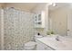 Full bathroom featuring a shower with curtain, toilet, mirror, and sink with cabinet at 904 Oldwyck Dr, Fuquay Varina, NC 27526