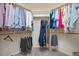 Walk-in closet featuring organized shelving with rods and racks for clothing and a neutral carpeted floor at 904 Oldwyck Dr, Fuquay Varina, NC 27526