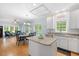 Spacious kitchen with an island, granite countertops, stainless appliances, and adjacent dining area at 904 Oldwyck Dr, Fuquay Varina, NC 27526