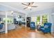 Spacious living room featuring natural light, hardwood floors, a fireplace, and comfortable seating arrangements at 904 Oldwyck Dr, Fuquay Varina, NC 27526