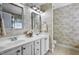Bathroom with dual sinks, tile flooring, and decorative wallpaper at 908 Town Side Dr, Apex, NC 27502