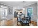 Bright breakfast nook with hardwood floors and views of the outdoors at 908 Town Side Dr, Apex, NC 27502