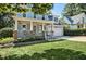 Charming two-story home with a welcoming front porch and well-maintained lawn at 908 Town Side Dr, Apex, NC 27502