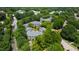 Aerial view showcases the community's beautiful buildings, surrounded by mature trees and green spaces at 911 Washington St # 304, Raleigh, NC 27605