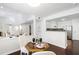 Open dining area featuring hardwood floors and view of the kitchen and living room at 911 Washington St # 304, Raleigh, NC 27605