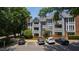 Exterior of a well-maintained building with parking spaces and lush landscaping enhances curb appeal at 911 Washington St # 304, Raleigh, NC 27605
