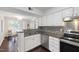 Bright kitchen with granite counters, stainless appliances and view to sunlit dining room at 911 Washington St # 304, Raleigh, NC 27605