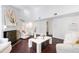 Open living room with hardwood floors, white walls, and a view of the kitchen area at 911 Washington St # 304, Raleigh, NC 27605