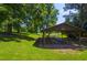 Covered picnic pavilion with multiple tables and benches, ideal for outdoor gatherings and events at 911 Washington St # 304, Raleigh, NC 27605