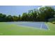 Well-maintained tennis courts surrounded by lush trees offer a great space for recreation and fitness at 911 Washington St # 304, Raleigh, NC 27605