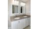 Bathroom features double sinks with granite countertops at 9136 Palm Bay Cir, Raleigh, NC 27617