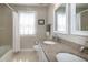 Bathroom features double sinks with granite countertops and tub with shower at 9136 Palm Bay Cir, Raleigh, NC 27617
