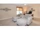 Bright bedroom with comfortable seating area, desk and woven shades at 9136 Palm Bay Cir, Raleigh, NC 27617