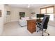 Bright bedroom features neutral walls, desk and ceiling fan at 9136 Palm Bay Cir, Raleigh, NC 27617
