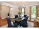 Traditional dining room featuring a wooden table, upholstered chairs, and elegant lighting at 9136 Palm Bay Cir, Raleigh, NC 27617